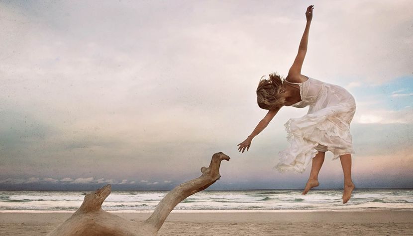 photograph of a woman against the background of the ocean